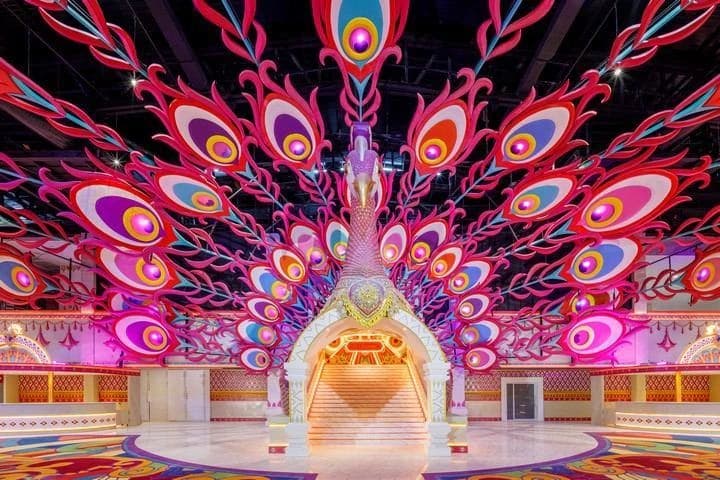 Grand ornamental peacock archway leading to a grand staircase